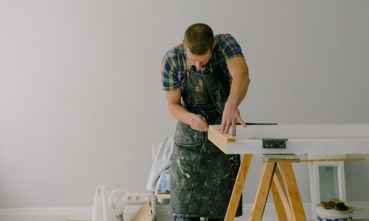 Concentrated man making repairs at home